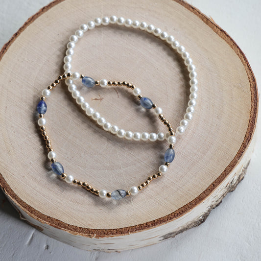 Paired Pearl, Gold, and Blue Bracelets